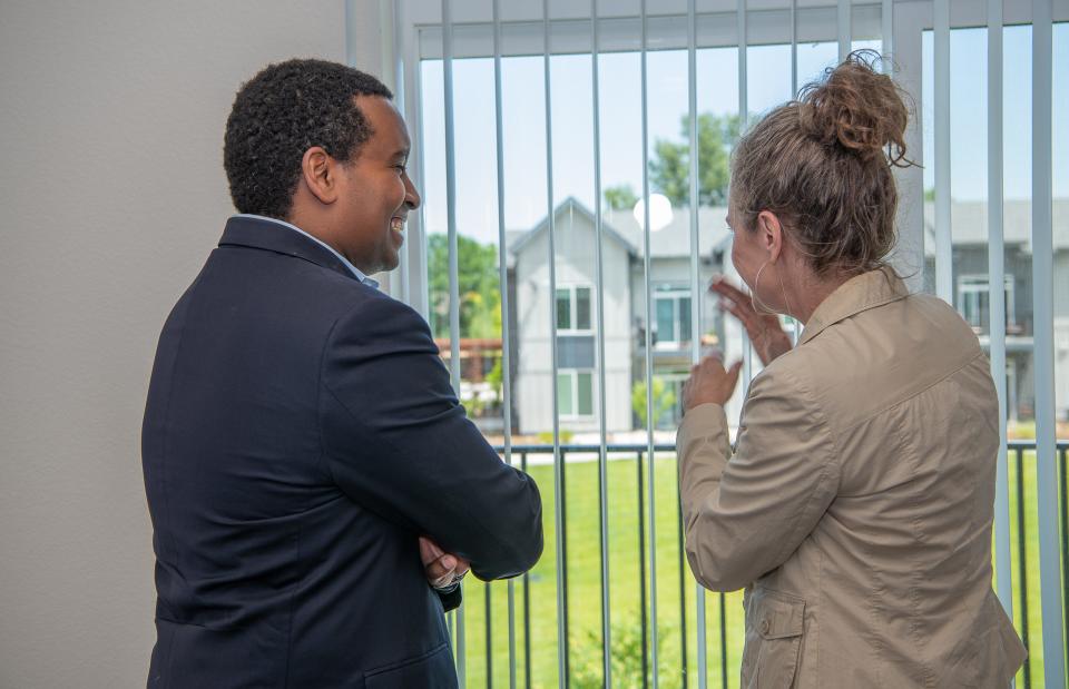 U.S. Rep. Joe Neguse stands with Housing Catalyst CEO Julie Brewen as they tour a three-bedroom unit at the affordable housing development Village on Horsetooth in Fort Collins in this file photo. The development was the first city land bank property to be sold and turned into affordable housing.