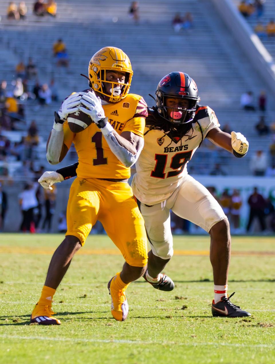 Oregon State Beavers defensive back Skyler Thomas (19) looks to tackle Arizona State Sun Devils running back Xazavian Valladay (1) at Sun Devil Stadium Nov. 19, 2022, in Tempe, Arizona.