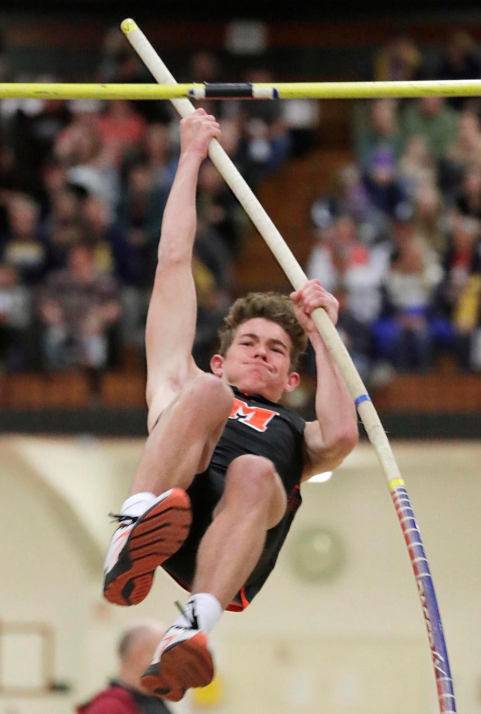 Mishicot's Adam Backus grimaces during his pole vault at the Earl Herbert indoor invitational track meet, Thursday March 24, 2022, in Manitowoc, Wis.