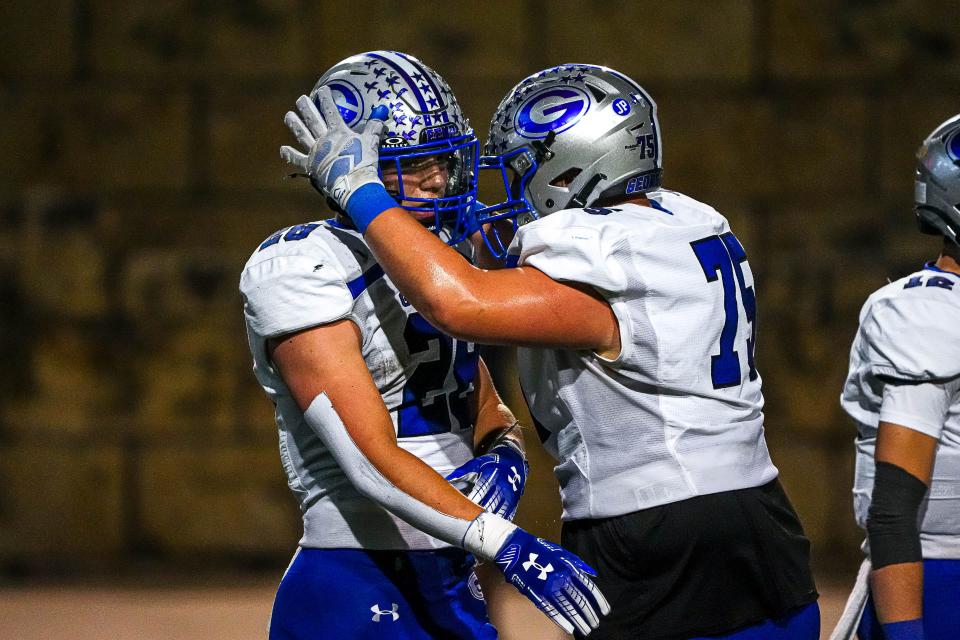 Georgetown offensive lineman Brant Hargrove (75) celebrates a touchdown by running back Jett Walker (28) during the game against Rouse at John Gupton Stadium on Thursday, Oct. 10, 2024 in Cedar Park, Texas.