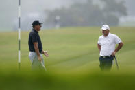 Phil Mickelson, left, talks with Bryson DeChambeau on the 12th hole during a practice round of the U.S. Open Golf Championship Monday, June 14, 2021, at Torrey Pines Golf Course in San Diego. (AP Photo/Gregory Bull)