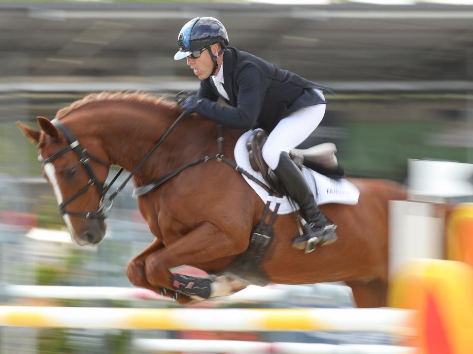 rider andrew hoy competing at the german equestrian championship in 2021