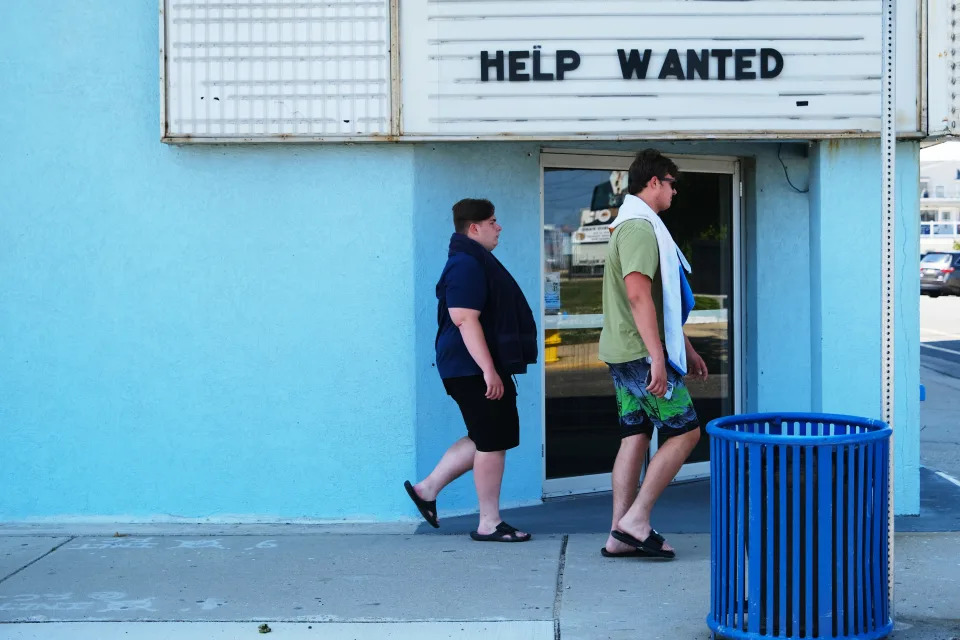 WILDWOOD, NEW JERSEY - MAY 27: A help wanted sign is displayed outside of a business near the boardwalk days before the Memorial Day weekend, the unofficial start of summer, in the shore community of Wildwood on May 27, 2021 in Wildwood, New Jersey. Wildwood, like many beach communities throughout the United States, is looking for a successful and busy summer season after staying mostly closed or partially open last summer due to Covid-19 restrictions. Many resort community retail businesses are also suffering from a shortage of labor as some workers are choosing to stay home and others have changed career paths.  (Photo by Spencer Platt/Getty Images)