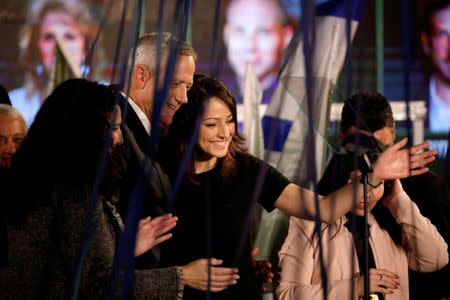 Gadeer Mreeh, a Druze women running on a ticket alongside former armed forces chief Benny Gantz, stands next to Gantz during a party event in Tel Aviv, Israel February 19, 2019. Picture taken February 19, 2019. REUTERS/Amir Cohen