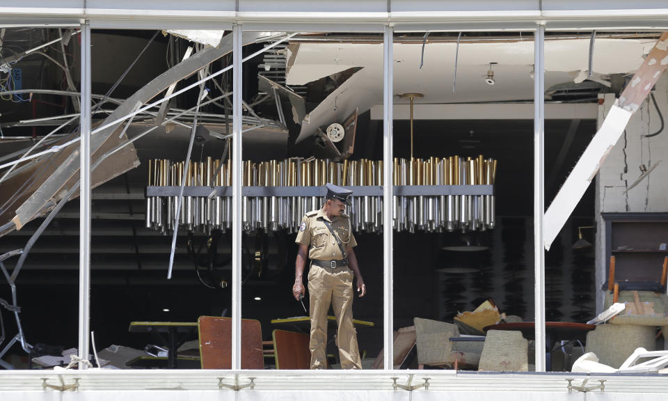 A Sri Lankan Police officer inspects a blast spot at the Shangri-la hotel in Colombo, Sri Lanka, Sunday, April 21, 2019. (Photo: Eranga Jayawardena/AP)