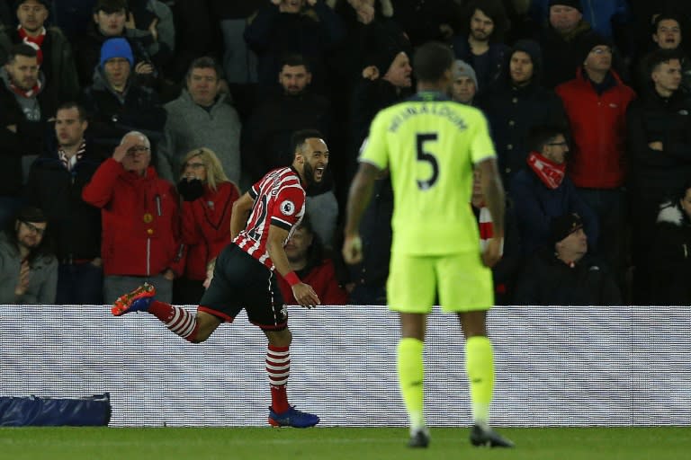 Southampton's Nathan Redmond (L) celebrates his goal during their League Cup semi-final first leg against Liverpool at St Mary's Stadium in Southampton, southern England on January 11, 2017