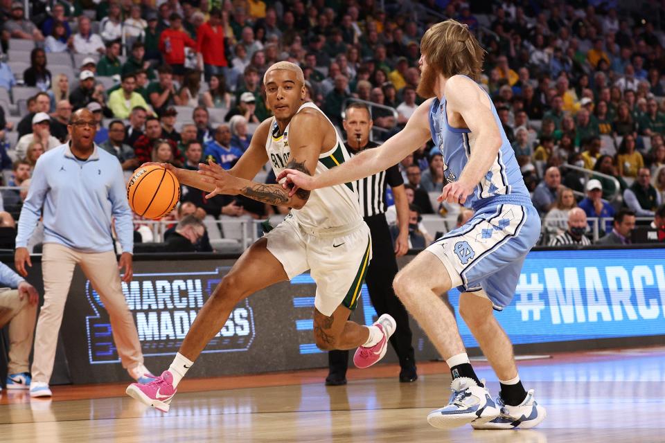Baylor's Jeremy Sochan (1) dribbles the ball as North Carolina's Brady Manek (45) defends during a second-round NCAA Tournament game on March 19 in Fort Worth, Texas.