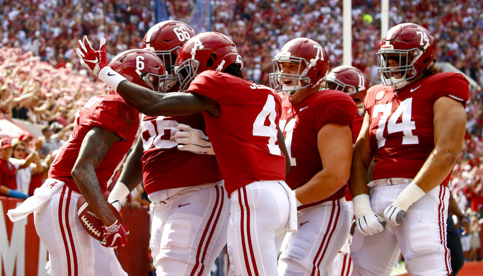 Alabama wide receiver DeVonta Smith (6) celebrates with teammates after scoring a touchdown during the first half of an NCAA college football game against Texas A&M, Saturday, Sept. 22, 2018, in Tuscaloosa, Ala. (AP Photo/Butch Dill)