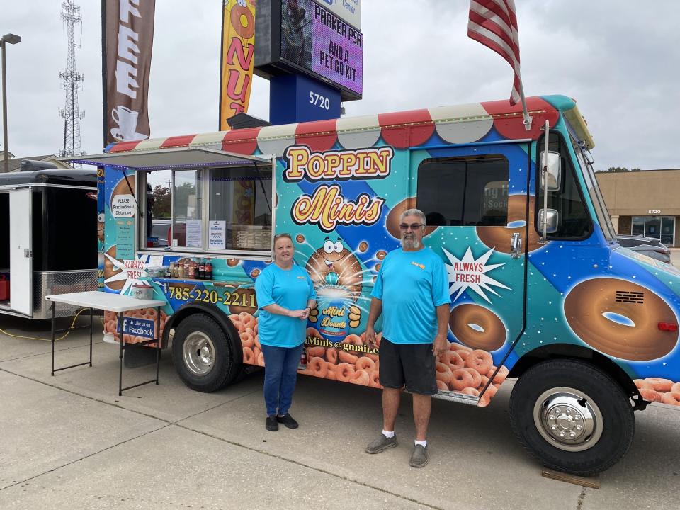 Sharon and Richard Fergison stand in front of their Poppin Minis food truck.