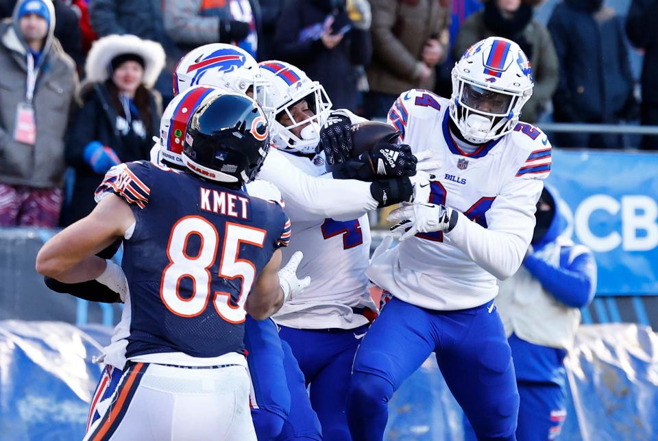 Dec 24, 2022; Chicago, Illinois, USA; Buffalo Bills safety Jaquan Johnson (4) makes an interception against the Chicago Bears during the second half at Soldier Field. Mandatory Credit: Mike Dinovo-USA TODAY Sports