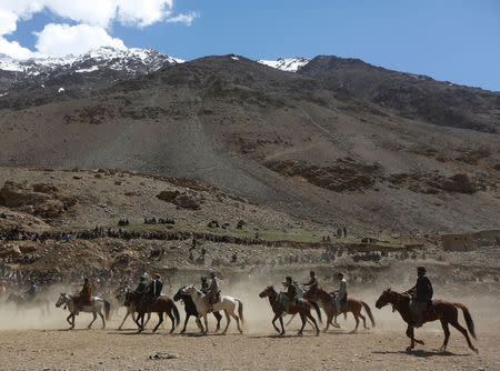 Afghan horsemen compete during a Buzkashi game in Panjshir province, north of Kabul, Afghanistan April 7, 2017. REUTERS/Omar Sobhani