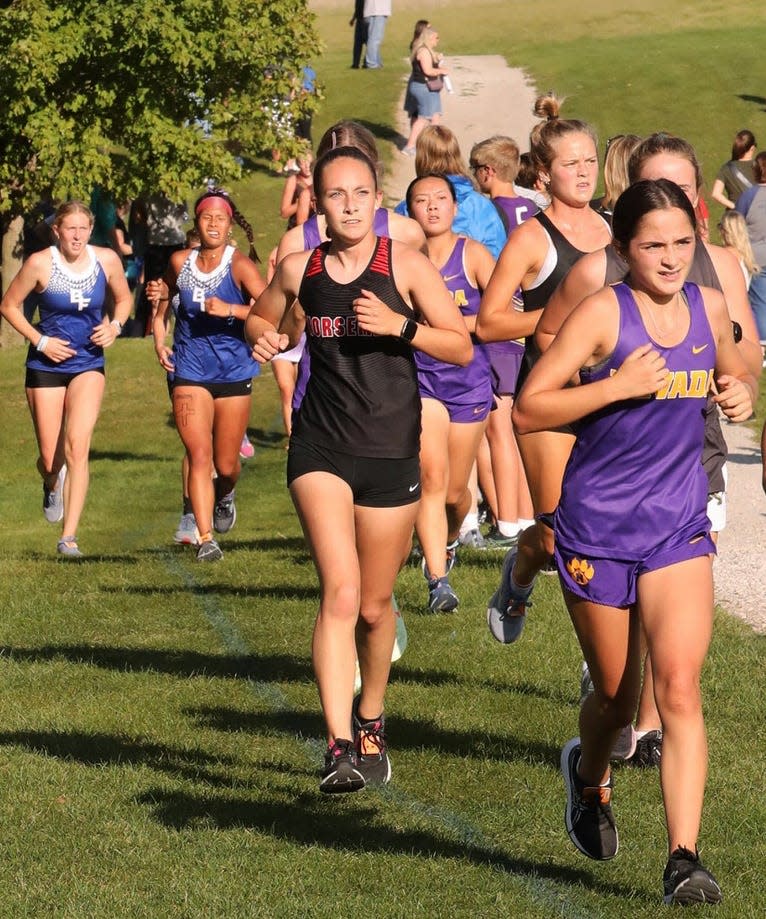 Brooke Thompson competes for the Roland-Story girls cross country team at the Mike Carr Invitational in Huxley Sept. 12.