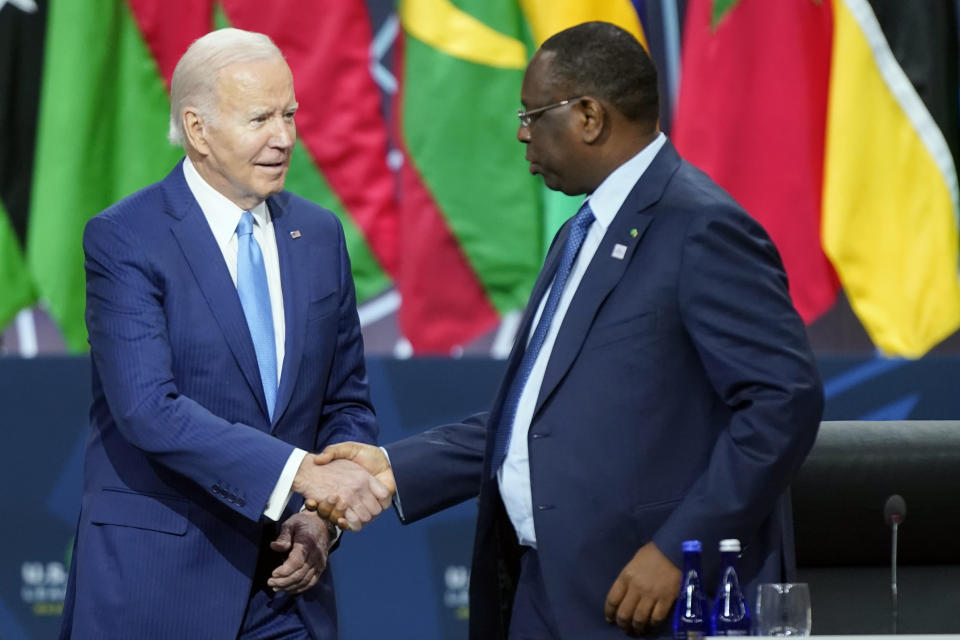 President Joe Biden shakes hands with Senegal's President Macky Sall, chair of the African Union, as he arrives to participate in the U.S.-Africa Summit Leaders Session on partnering on the African Union's Agenda 2063, Thursday, Dec. 15, 2022, in Washington. (AP Photo/Patrick Semansky)