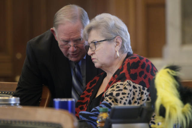 Kansas House Speaker Dan Hawkins, left, R-Wichita, confers with state Rep. Brenda Landwehr, R-Wichita, ahead of a House debate on a proposed "born-alive infants protection," law to apply to abortion providers, Tuesday, March 21, 2023, at the Statehouse in Topeka, Kan. Landwehr is chair of the House health committee, and it handled the measure, which would require providers to try to preserve the lives of infants born during unsuccessful abortions. (AP Photo/John Hanna)
