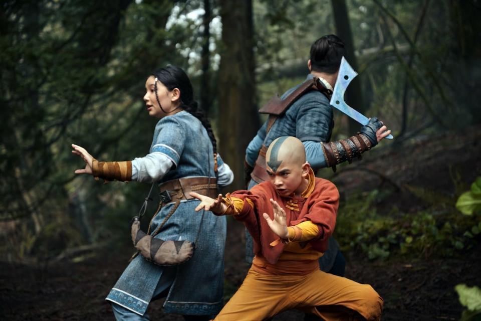 Gordom Cormier, centre, appears alongside Kiawentiio Tarbell, left, and Ian Ousley in a still from Avatar: The Last Airbender.