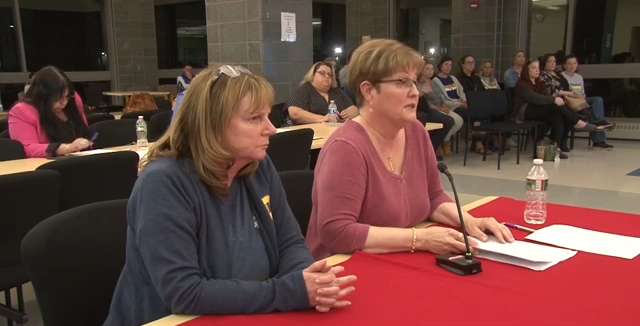 Roosevelt Middle School special education teacher Teri Desrosiers and counselor/NBEA building rep Patty Benner speak at the May 13 School Committee meeting.