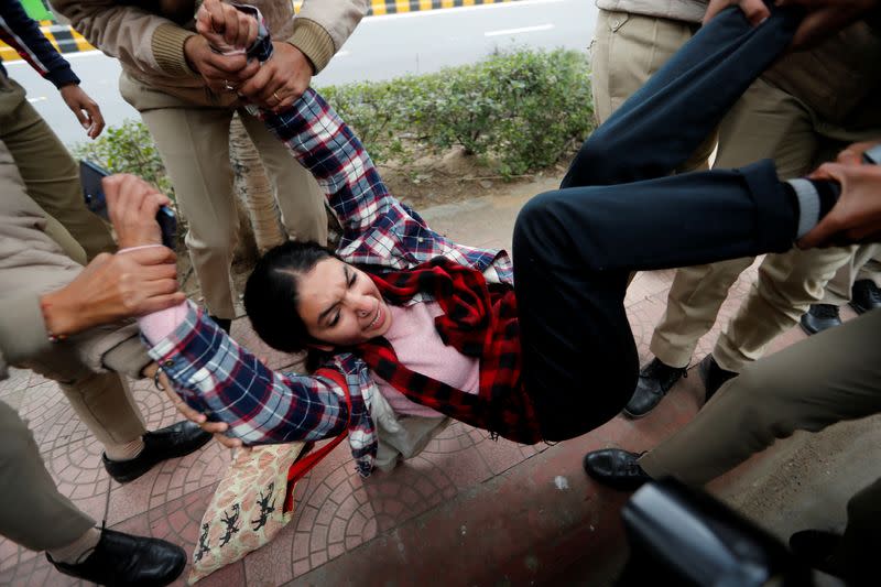 Police detain demonstrators following days of deadly protests across India against a new citizenship law, in New Delhi