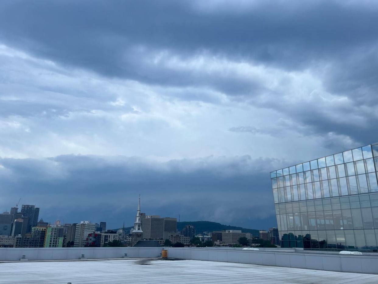 The skies over Montreal darkened as Environment and Climate Change Canada advised the public to take cover immediately if threatening weather approaches. (Verity Stevenson/CBC - image credit)