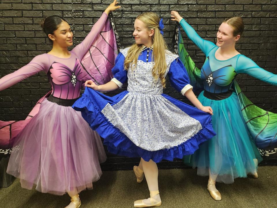 Sofia Ali, left, portraying a butterfly, Eden Holmes portraying Alice, center, and Emma Pittman portraying a butterfly prepare for the upcoming production of Lone Star Ballet's "Alice in Wonderland." The production will be held April 14-15 at the Globe-News Center for the Performing Arts.