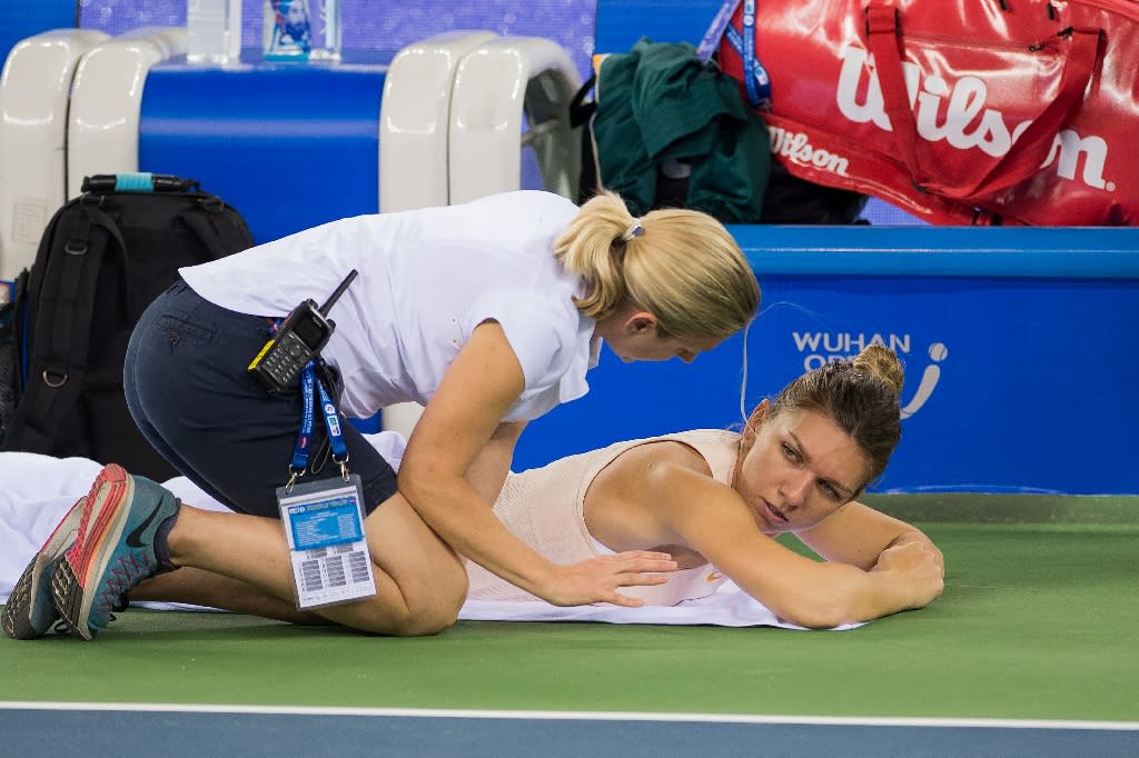 Simona Halep fails to recover from a back injury suffered at the Wuhan Open in September, and withdraws from the WTA Finals Singapore. (Photo: AFP/Nicolas Asfouri)