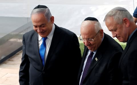 Mr Netanyahu and Mr Gantz with Israeli president Reuven Rivlin (centre) - Credit: &nbsp;REUTERS/Ronen Zvulun