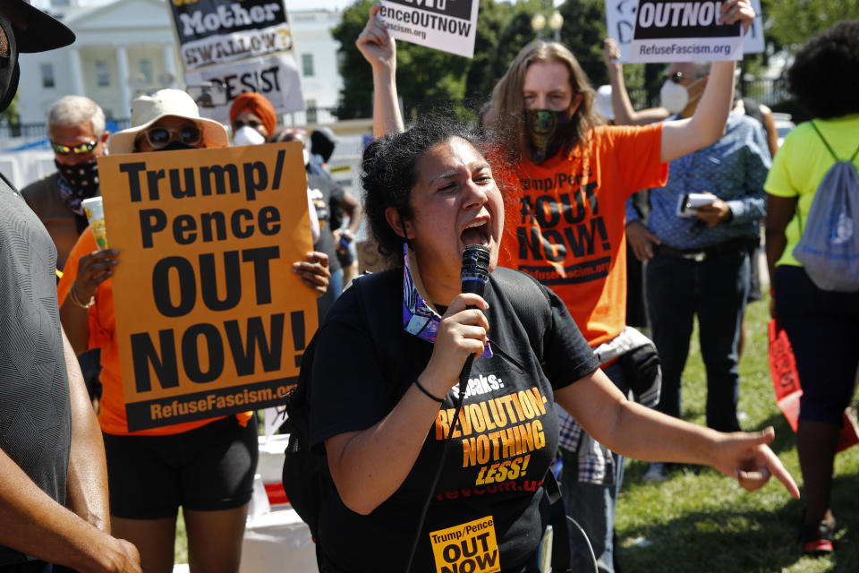 Protesters demonstrate in Lafayette Park near the White House in Washington, Sunday, June 14, 2020. (AP Photo/Patrick Semansky)