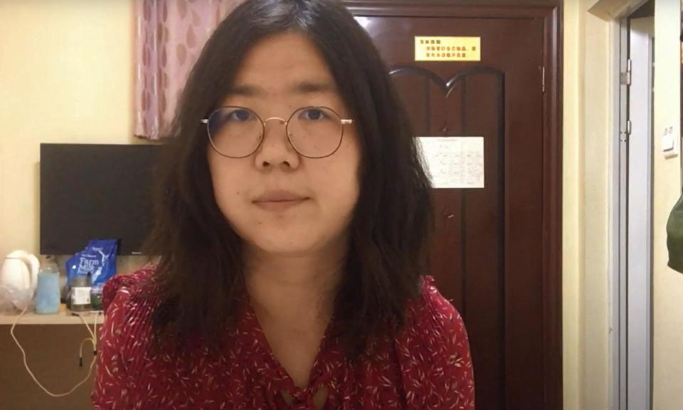 <span>Zhang Zhan went on hunger strikes over her detention for four years for reporting on events in Wuhan.</span><span>Photograph: YouTube/AFP/Getty Images</span>
