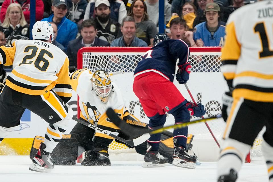 Columbus Blue Jackets left wing Johnny Gaudreau (13) scores the game-winning goal past Pittsburgh Penguins goaltender Tristan Jarry (35) during the overtime of the NHL hockey game at Nationwide Arena on April 13, 2023. The Blue Jackets won 3-2.