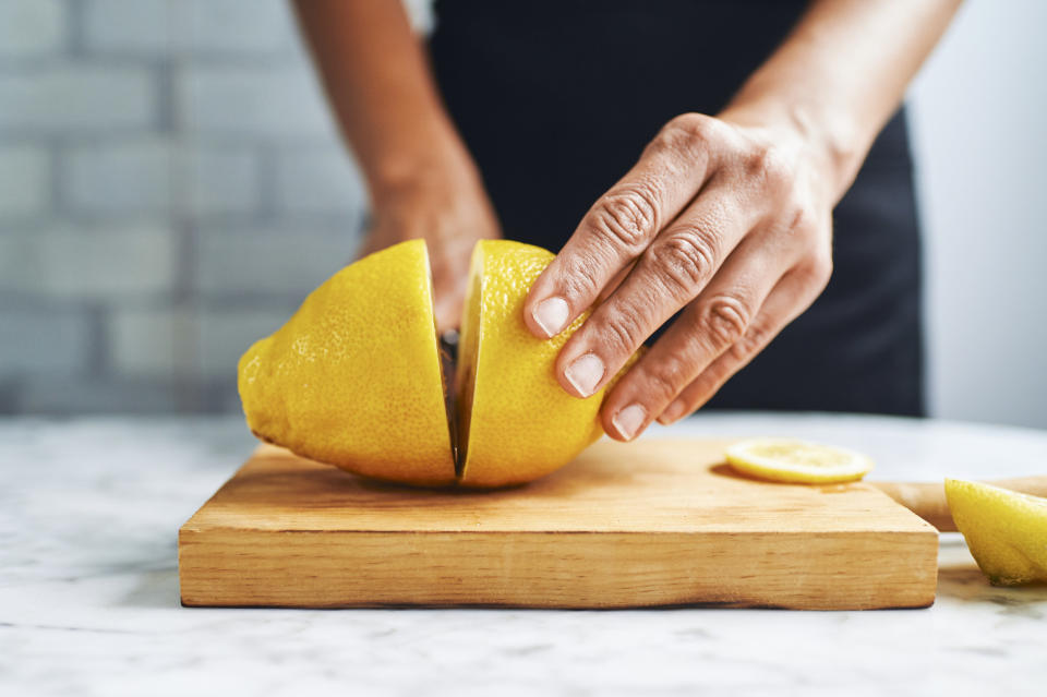 someone cutting a lemon