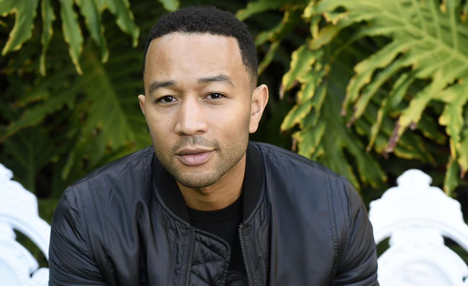 FILE - This Nov. 21, 2016 file photo shows singer-songwriter John Legend during a portrait session in West Hollywood, Calif. Legend is nominated for a Grammy for best traditional pop vocal album with his holiday album, "A Legendary Christmas."(Photo by Chris Pizzello/Invision/AP, File)