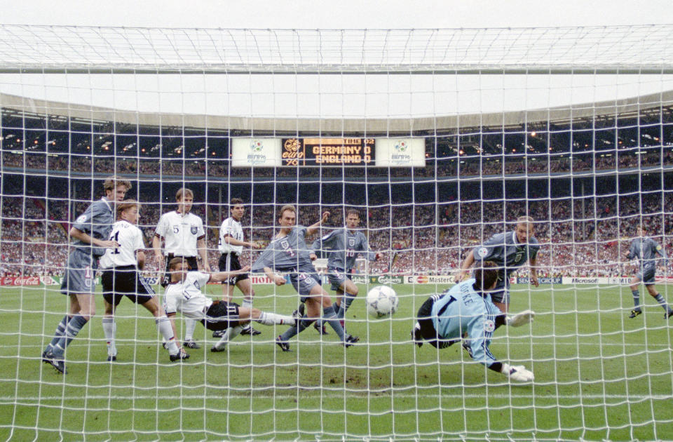 Alan Shearer (back right) gave England the lead with his header in the Euro 96 semifinal against Germany. (Photo by Ross Kinnaird/Allsport/Getty Images/Hulton Archive)