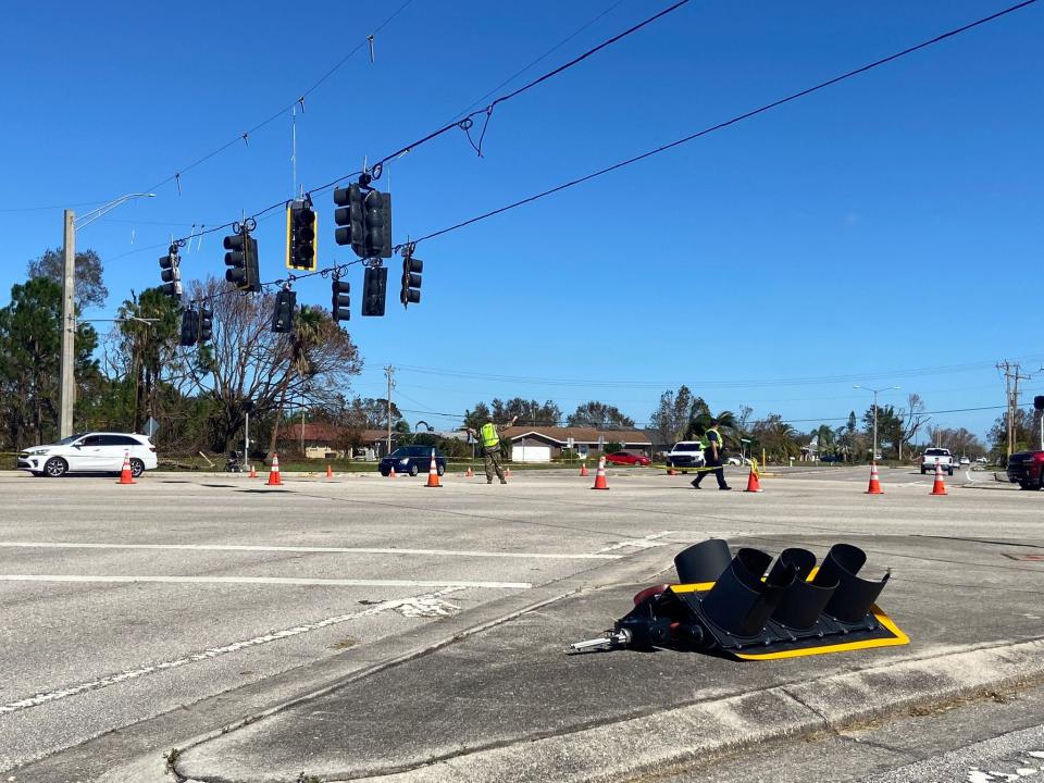 Members of the National Guard and Cape Coral Police direct traffic at the intersection of Country Club Blvd and Veterans Pkwy.