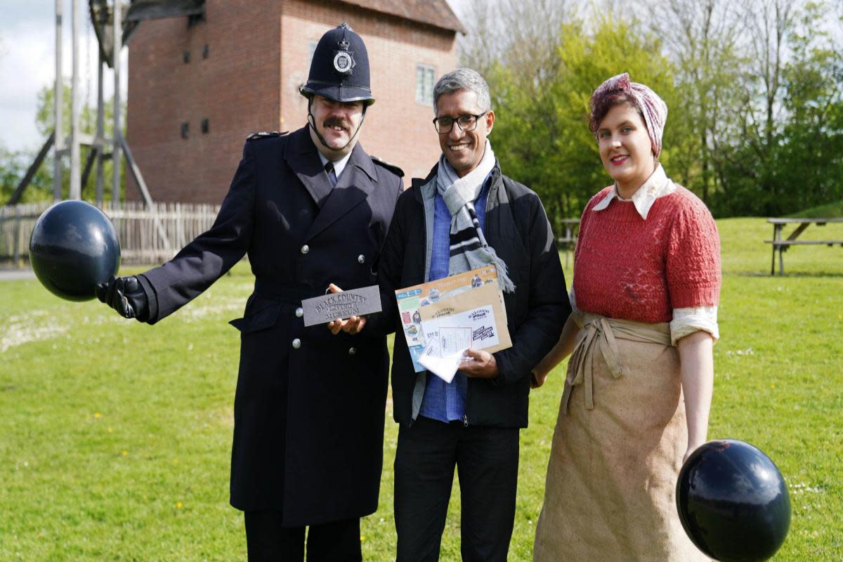 Ian Castelino (centre) with costumed characters at the museum <i>(Image: Black Country Living Museum)</i>