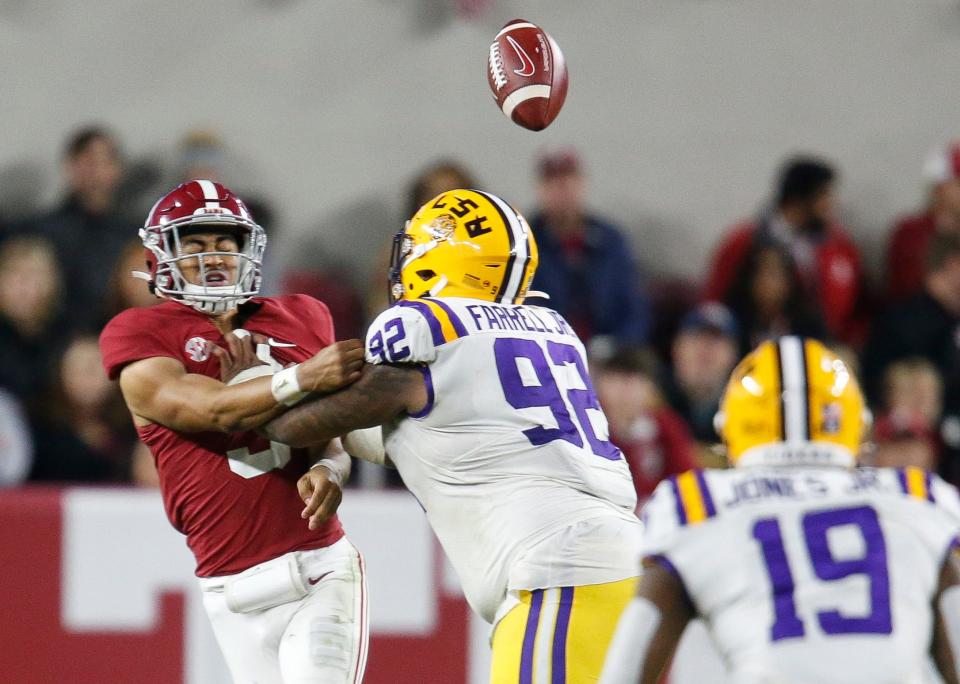 Alabama quarterback Bryce Young (9) throws under pressure from LSU during their 2021 game at Bryant-Denny Stadium.