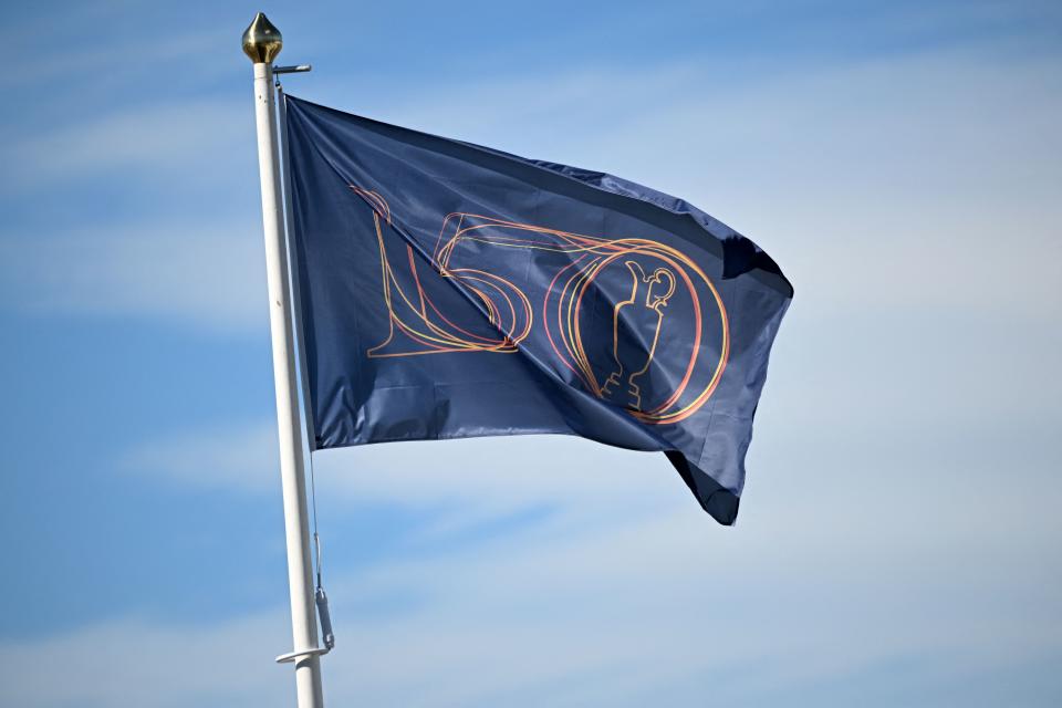 A flag shows the claret Jug emblem and the '150' during practice for The 150th British Open Golf Championship on The Old Course at St Andrews in Scotland on July 10, 2022. - RESTRICTED TO EDITORIAL USE (Photo by Andy Buchanan / AFP) / RESTRICTED TO EDITORIAL USE (Photo by ANDY BUCHANAN/AFP via Getty Images)