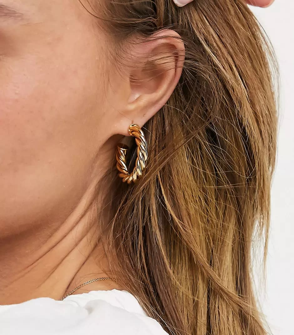 ASOS DESIGN 14k gold plated twist hoop earrings. (ASOS)