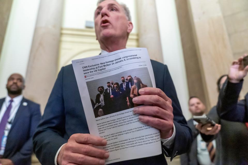 House Speaker Kevin McCarthy speaks to the media as he holds a copy of a CNN article, Tuesday, March 7, 2023 at the Capitol in Washington. McCarthy's decision to unleash a trove of Jan. 6 Capitol attack footage to Fox News' Tucker Carlson has launched a wholesale Republican effort to rewrite the history of the deadly siege. Carlson aired the first installment of some 41,000 hours of security footage on his prime-time show and promised more Tuesday. (AP Photo/Alex Brandon) ORG XMIT: DCAB123