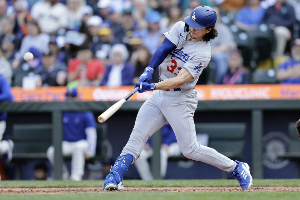 Los Angeles Dodgers' James Outman hits a solo home run off Seattle Mariners relief pitcher Dominic Leone during the eighth inning of a baseball game, Sunday, Sept. 17, 2023, in Seattle. (AP Photo/John Froschauer)