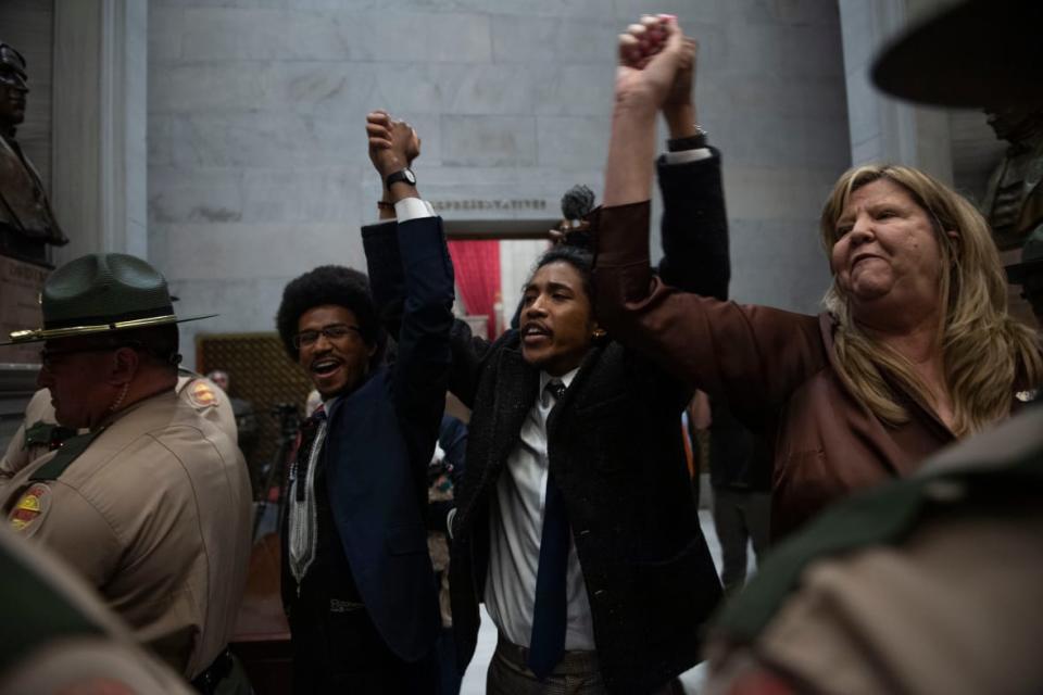 Former Democratic Reps. Justin Pearson of Memphis and Justin Jones of Nashville, along with Rep. Gloria Johnson of Knoxville hold their hands up as they exit the House chamber doors at the Tennessee state Capitol building in Nashville, Tennessee, on April 3, 2023. (Photo credit: Nicole Hester/The Tennessean/USA Today Network RANK 1 knox Capitol Tenn 3 005)