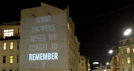 A light installation commemorating Holocaust victims is seen on a wall in the second district of Vienna October 23, 2013. November 9th marks the 75th anniversary of the 'Kristallnacht' ('crystal night' or also referred to as 'night of broken glass') when Nazi thugs conducted a wave of violent anti-Jewish pogroms on the streets of Vienna and other cities in 1938 in Austria and Germany. Picture taken October 23, 2013. REUTERS/Leonhard Foeger