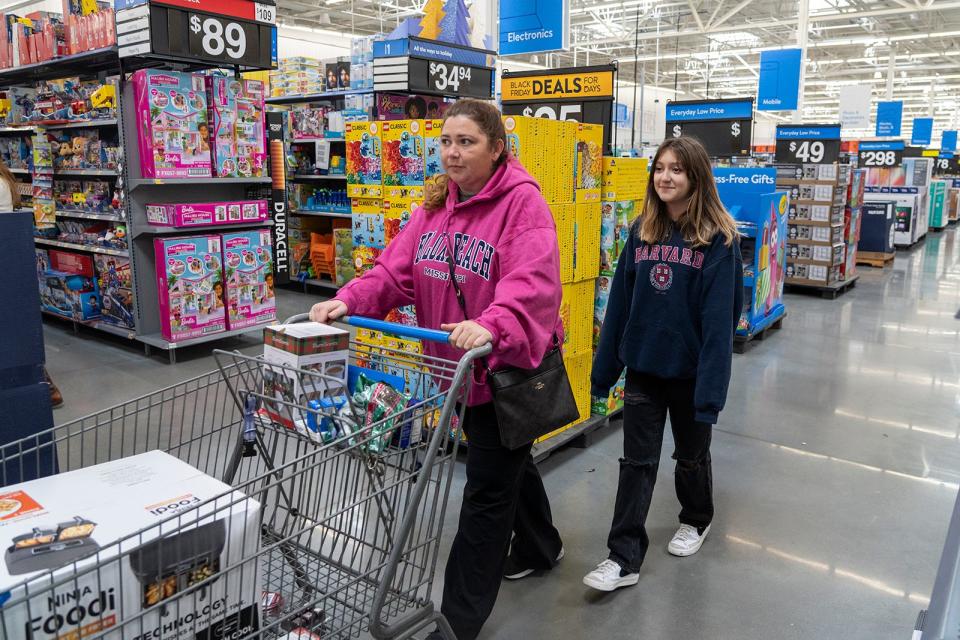 Chrystal Roper and her daughter Maddy shop for early Black Friday deals at the Walmart on Whitestone Boulevard in Cedar Park on Nov. 16. "We decided to start the deals earlier this year, rather than one Black Friday event," said Lauren Willis, director of global communications for Walmart.