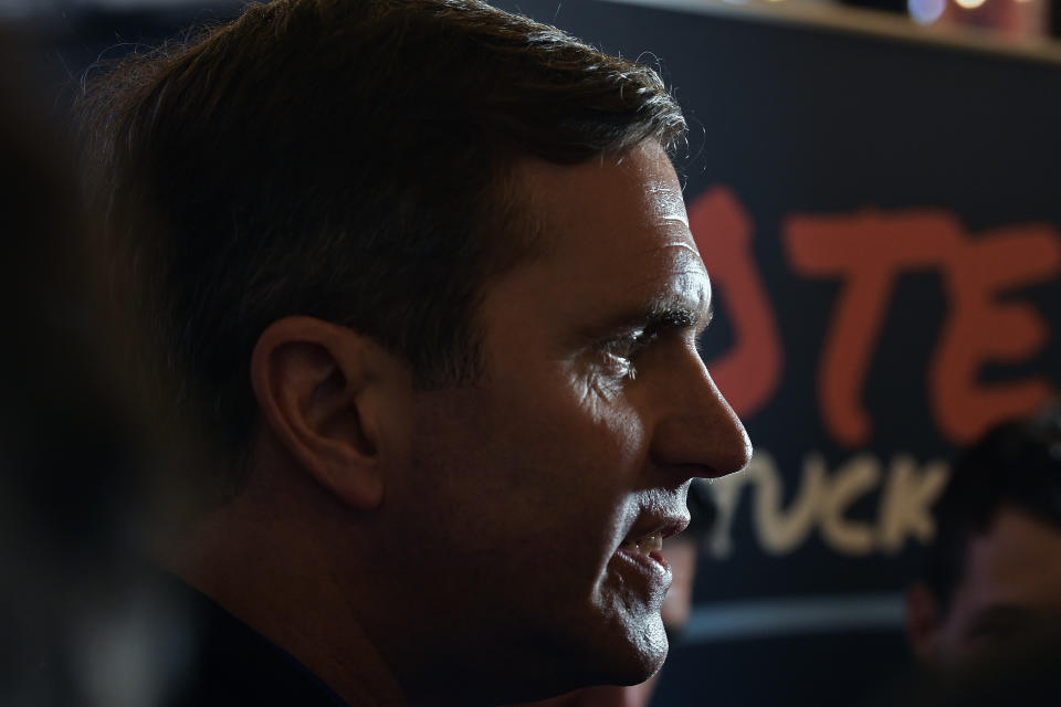 Kentucky Governor and Democratic candidate for re-election Andy Beshear speaks to reporters during a stop of his statewide bus tour in Richmond, Ky., Monday, Oct. 30, 2023. (AP Photo/Timothy D. Easley)