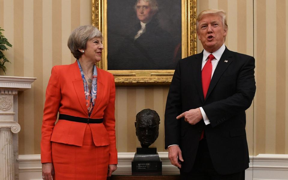 Donald Trump showed the bust of Winston Churchill in the Oval Office to Theresa May in 2017 - Stefan Rousseau/PA Wire