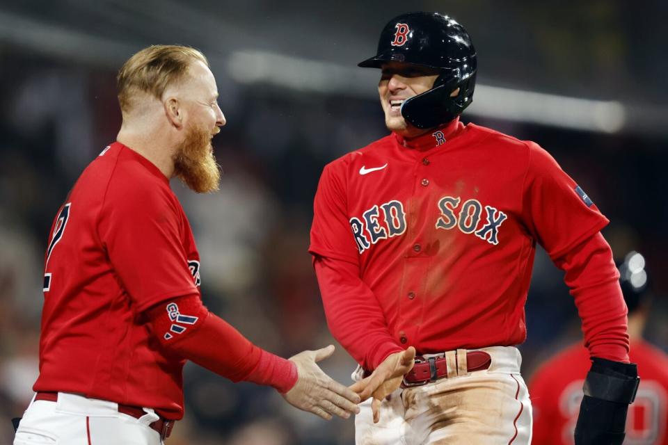 Boston&#39;s Kik&#xe9; Hernandez, right, celebrates with Justin Turner after scoring with Triston Casas on a two-run single.