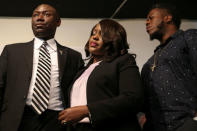 Tiffany Crutcher (C), sister of Terence Crutcher, the Tulsa motorist who was shot and killed by police, stands with attorney Benjamin Crump (L) during a news conference at the Reverend Al Sharpton's National Action Network headquarters in New York, U.S., September 21, 2016. REUTERS/Shannon Stapleton