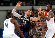 Aug 17, 2016; Rio de Janeiro, Brazil; Argentina small forward Andres Nocioni (13) loose ball control of the ball against USA forward Draymond Green (14) and USA forward Kevin Durant (5) during the men's basketball quarterfinals in the Rio 2016 Summer Olympic Games at Carioca Arena 1. Mandatory Credit: Jeff Swinger-USA TODAY Sports