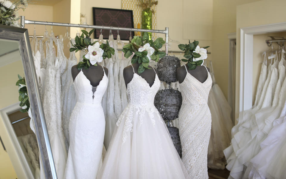 Wedding dresses are displayed at Complete Bridal, a shop in East Dundee, Illinois, on February 28, 2020. The store is heavily reliant on China for manufacturing. Factory closures there have meant fewer choices for brides. Those with weddings coming up soon have to buy off the rack and forego customization. (AP Photo/Teresa Crawford)