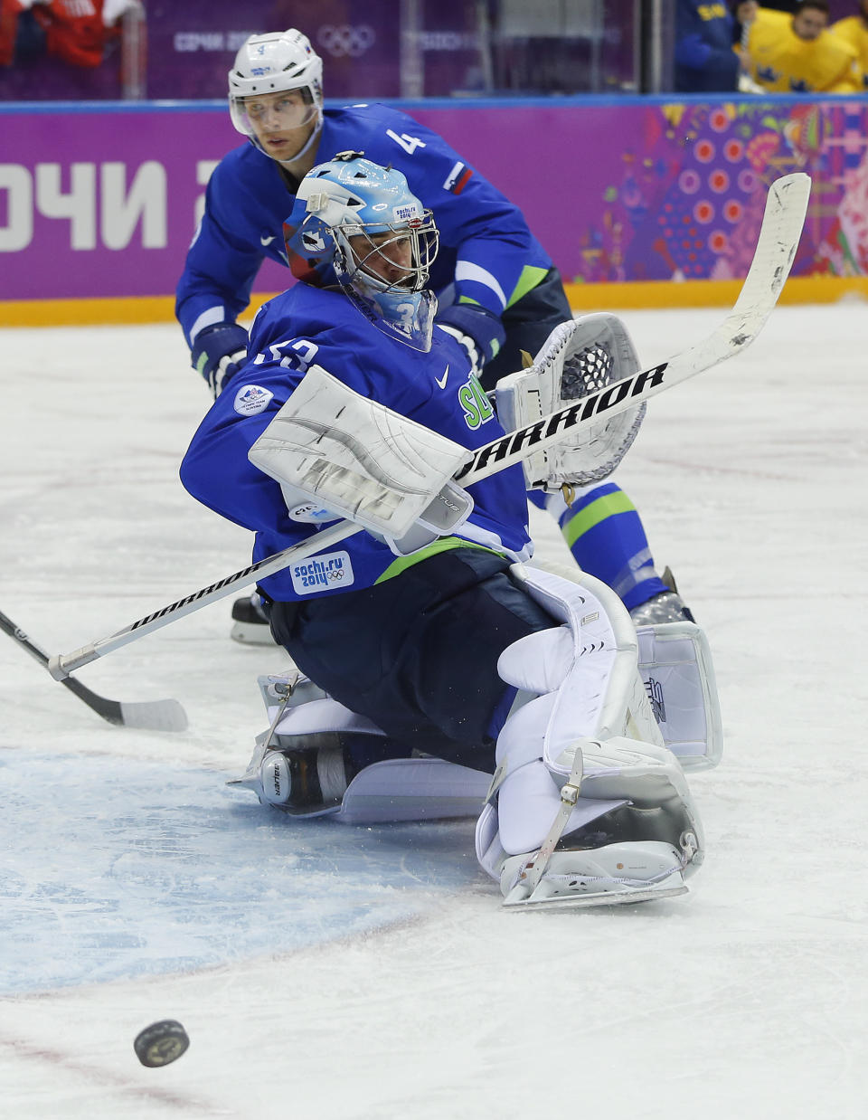 Slovenia goaltender Robert Kristan blocks a shot by Sweden in the second period of a men's quarterfinal ice hockey game at the 2014 Winter Olympics, Wednesday, Feb. 19, 2014, in Sochi, Russia. (AP Photo/Julio Cortez)