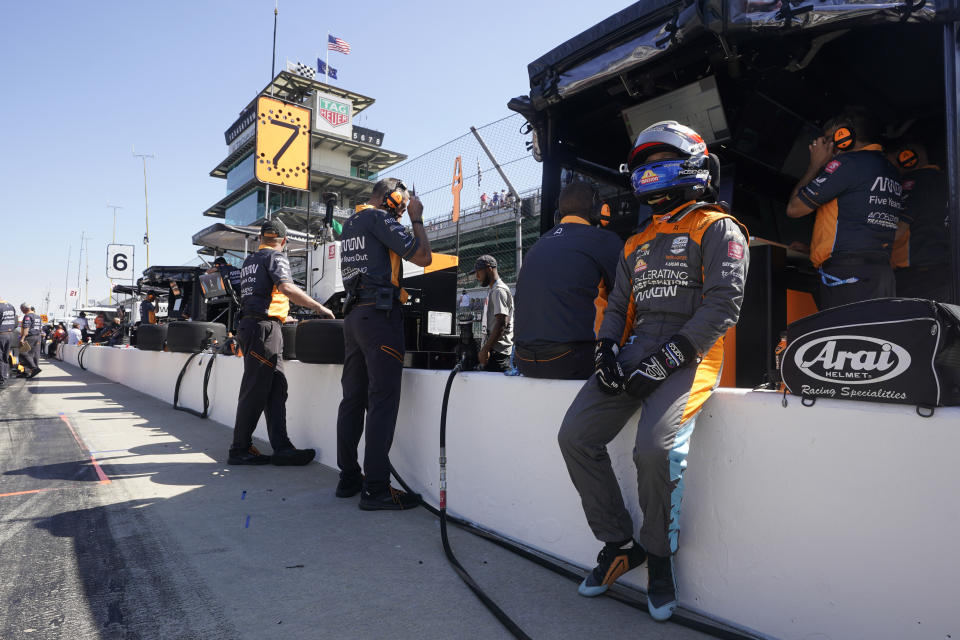 Felix Rosenqvist, of Sweden, waits along pit wall during practice for the Indianapolis 500 auto race at Indianapolis Motor Speedway, Tuesday, May 17, 2022, in Indianapolis. (AP Photo/Darron Cummings)