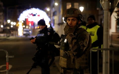 Police officers secure a street and the surrounding area after a shooting in Strasbourg - Credit:  VINCENT KESSLER/Reuters